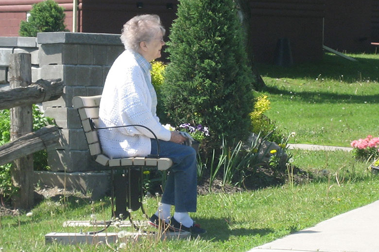 Resident outside on a bench