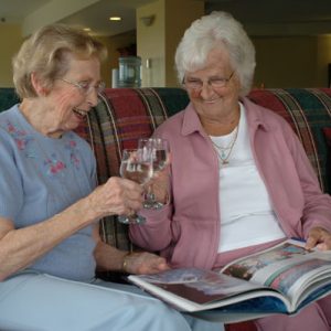 Seniors toasting with wine