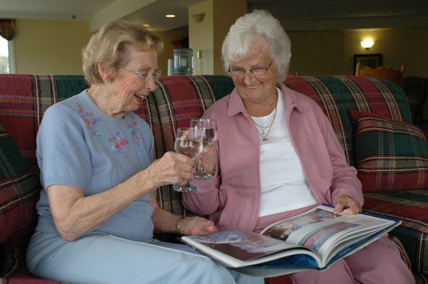 Seniors toasting with wine